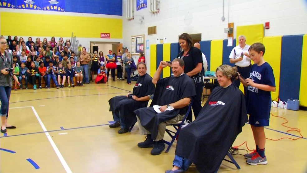 Faculty members shave their heads for student diagnosed with leukemia