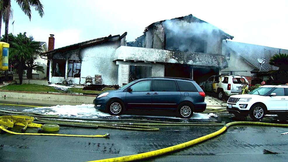 Image result for Plane crashes in California, houses burn