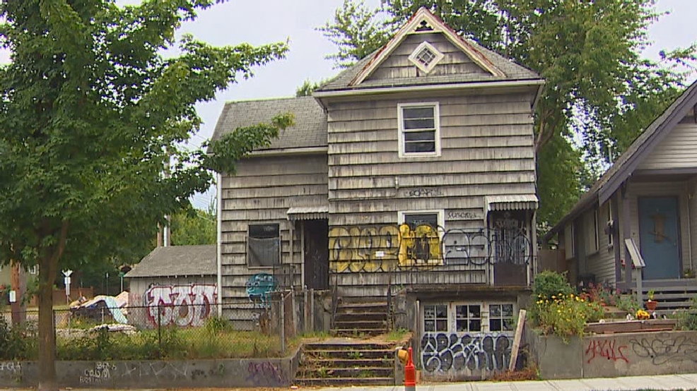 Dilapidated Seattle home, vandalized and unsafe to enter, fetches