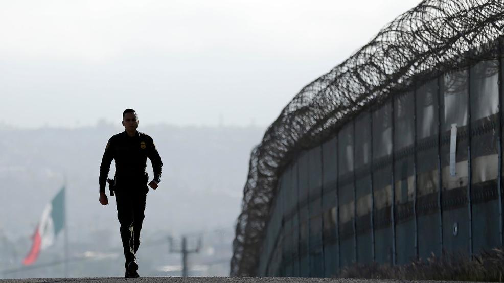 Border Captures Illegal immigration border fence silhoutte.jpg